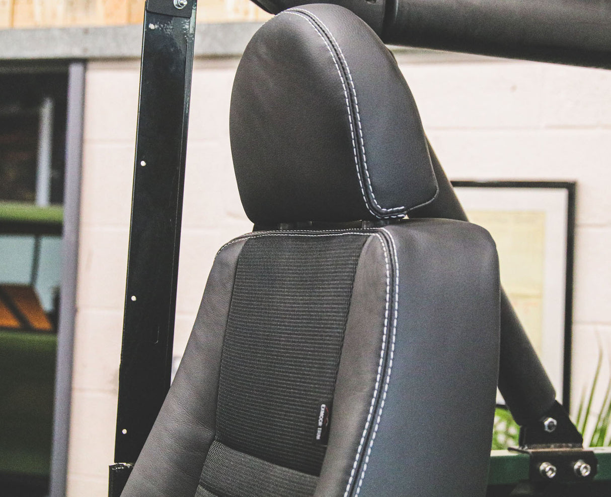 Defender "Puma" Frontsitz links (schwarzer Stoff, schwarzes Leder) beheizt